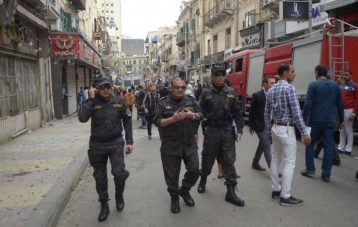 Egypt's special forces members take position at after an attack by a suicide bomber in front of a church in Alexandria