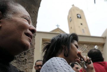 A relative of one of the victims reacts after a church explosion killed at least 21 in Tanta,