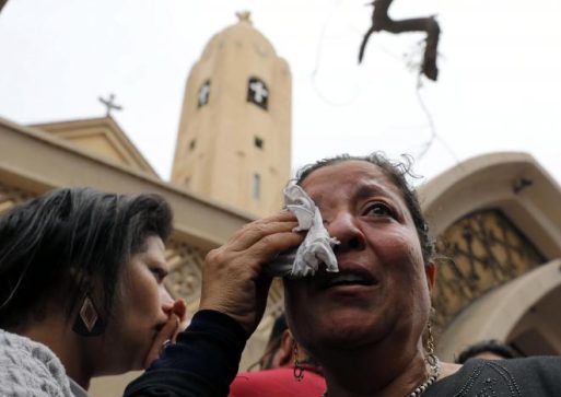 A relative of one of the victims reacts after a church explosion killed at least 21 in Tanta,